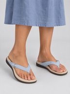 Goldie sandals in sky blue, worn with a dusty blue linen midi skirt
