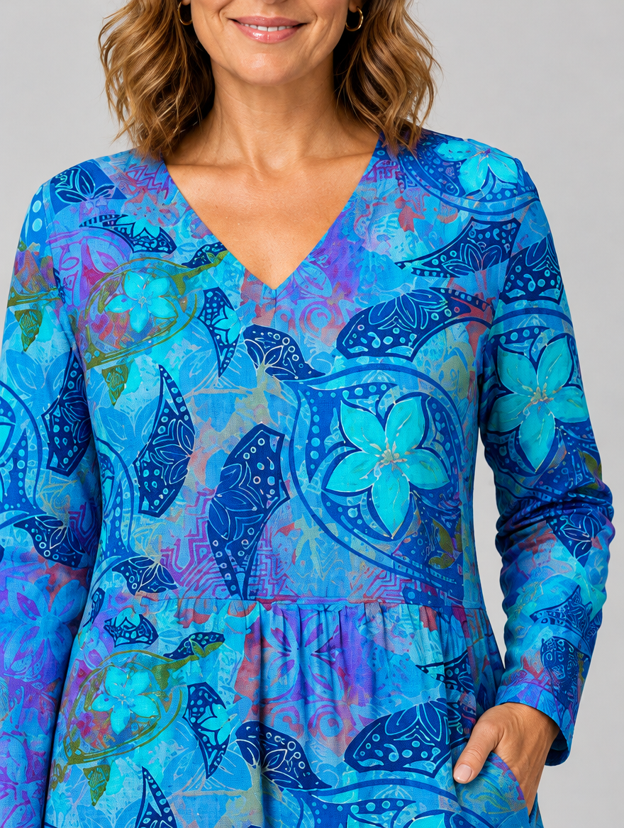 April long blouse in blue sea turtle and frangipani print, close up of print and neckline